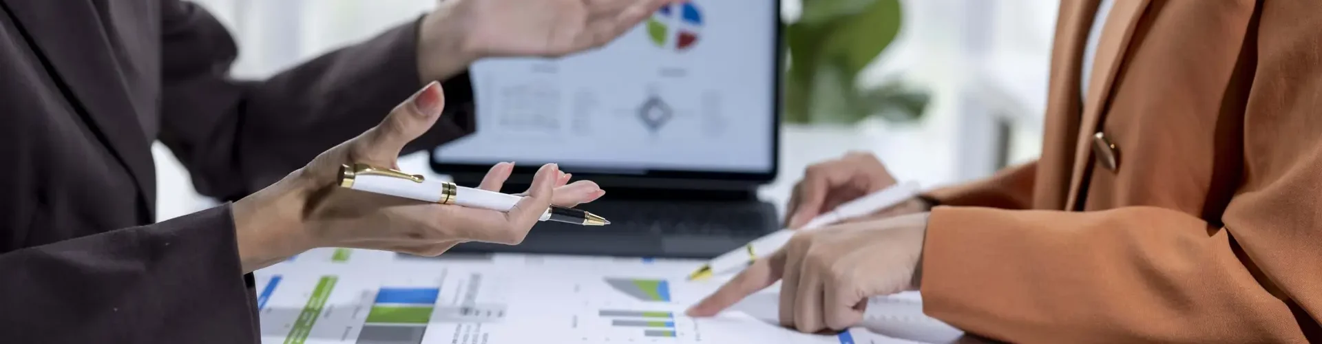two-businesswomen-analyzing-financial-graphs-and-c-2026-01-11-10-14-49-utc copia
